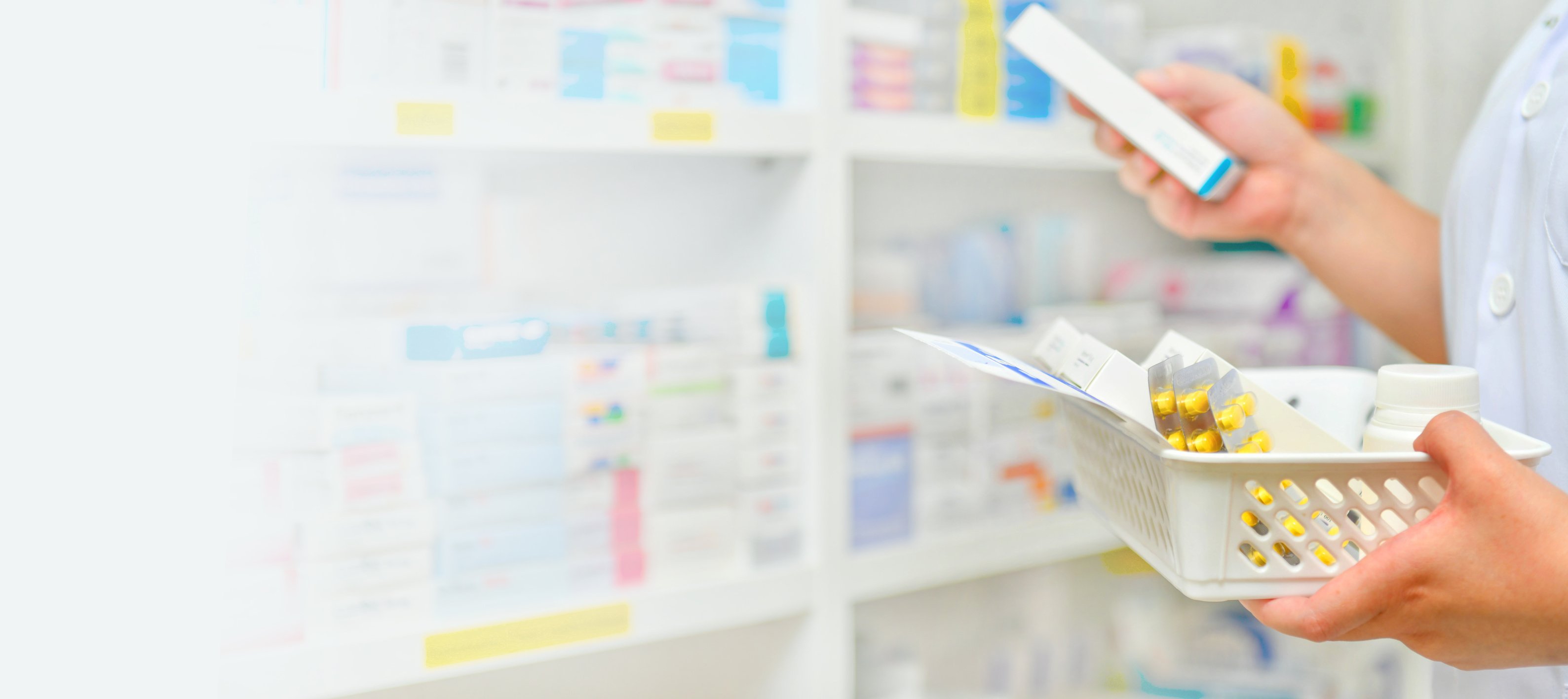 Pharmacist filling prescription in pharmacy drugstore